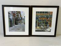 Both framed prints side by side showing full view