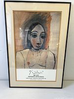 Front view of framed Picasso exhibition poster