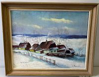 Front view of framed painting showing artwork, frame and signature