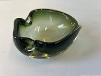 Angled view showing green gradient glass bowl and rim shape