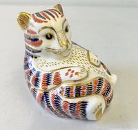 Front angled view of tiger cub paperweight showing Imari pattern and facial detailing