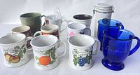 Group view of all mugs and canister