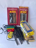 Overall lot including boxed Big Haulers track, loose HO track, locomotive, freight car, power pack and boxes