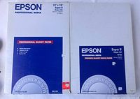 Front view of two Epson photo paper boxes