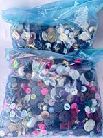 Two sealed gallon bags packed with mixed vintage buttons