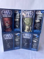Four boxed Star Wars ceramic goblet mug gift sets stacked, showing Chewbacca, Yoda, Darth Vader characters