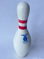 Front view showing blue eagle logo and red stripes