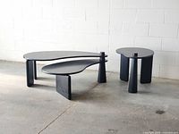 Front view of coffee table with swiveling two-tier top and matching side table