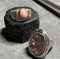 Both rings side by side showing stones and settings