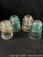 Group shot showing all four insulators, color and general condition