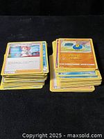 Two stacks of yellow-border Pokémon cards