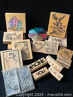 Full view of all wood-mounted stamps, clear stamp packs and ColorBox ink pad