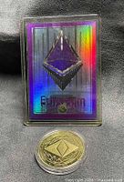 Front view of holographic Ethereum trading card with logo and Ethereum coin below