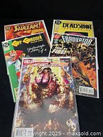 Front view of all five bagged comics