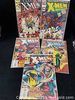 All five bagged comics laid out