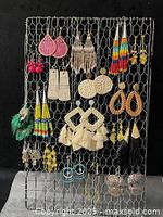 Full view of earring collection on mesh display