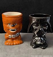 Front view of Chewbacca and Darth Vader ceramic mugs
