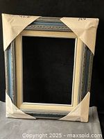 Front view of ornate wooden frame with protective corners