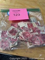 Full view of bagged stamps with lot tag