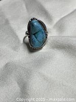 Front view of sterling silver ring with turquoise stone