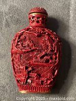 front view showing carved landscape