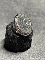 Front view showing oval rainbow drusy stone and bezel