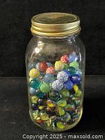Full view of jar with lid showing marbles inside