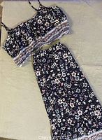 Full view crop top and skirt laid flat