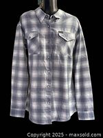 Front view of grey/white plaid long-sleeve flannel shirt