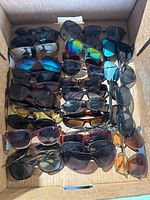 Full box showing 30 pairs of assorted sunglasses