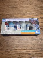 Front view of boxed set showing six bottles and label details