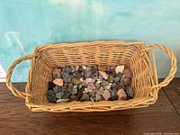 Full view of wicker basket partially filled with stones