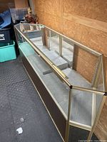 Full cabinet angled view showing glass panels, frame and base