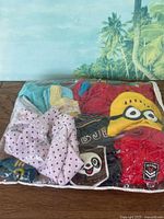 Bag showing assortment of children's clothing items