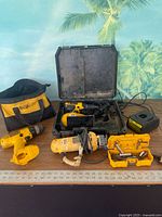 Entire lot with drills, cut-out tool, charger, bag, case, sockets