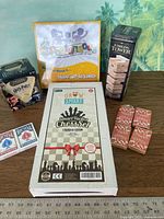 Group shot showing all six boxed games and card decks