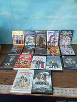 All 18 DVD/Blu-ray cases arranged on tabletop