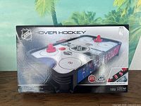 Front of sealed NHL Hover Hockey box showing game image