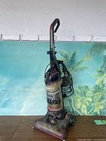 Full view of upright vacuum cleaner showing overall condition