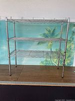 Front view of three-tier chrome wire shelf