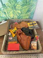 Overview of tote with holsters, clamps, nails, blades