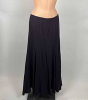 Front view of long dark wool skirt on mannequin