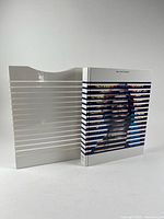 Book and slipcase standing side by side