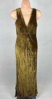 Front view of full-length olive velvet dress on mannequin