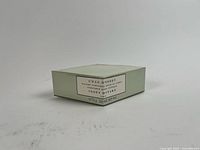 Front view of sealed box showing product name and net weight