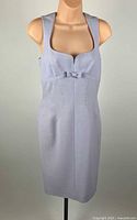 Front view of light grey Mugler sleeveless dress on mannequin