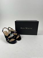 Pair of heels with Ron White box