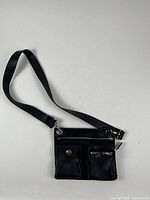 Front view showing pockets and strap