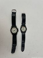 Front view of both Swiss Army watches showing dials and straps