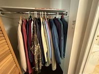 Closet rod showing full selection of jackets and sweaters